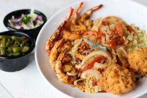 Diablo fish and shrimp served with vegetables